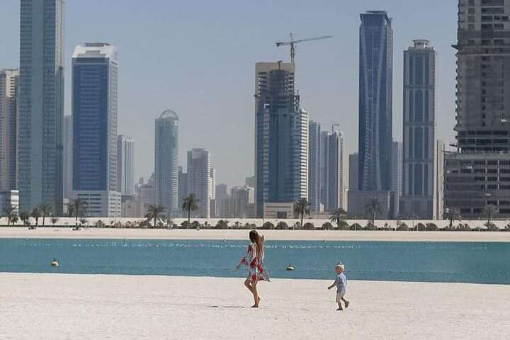 Soft white sands stretch before you complemented by glistening waters and towering palms. Experience serene moments with family enjoying the blend of nature and city right at Mamzar Beach.